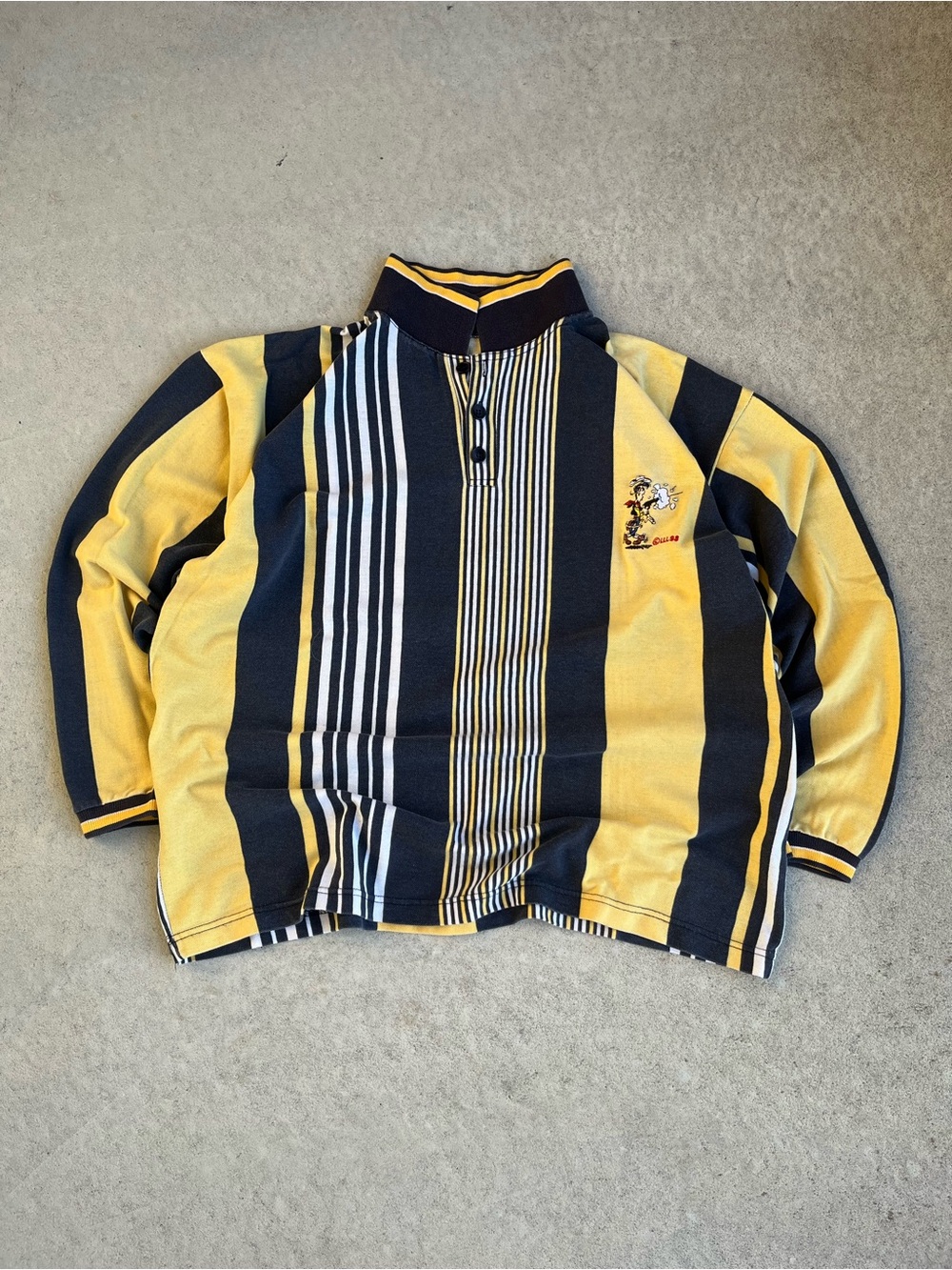 90s vintage Lucky Luke Men's Yellow and Black Striped Polo Sweater